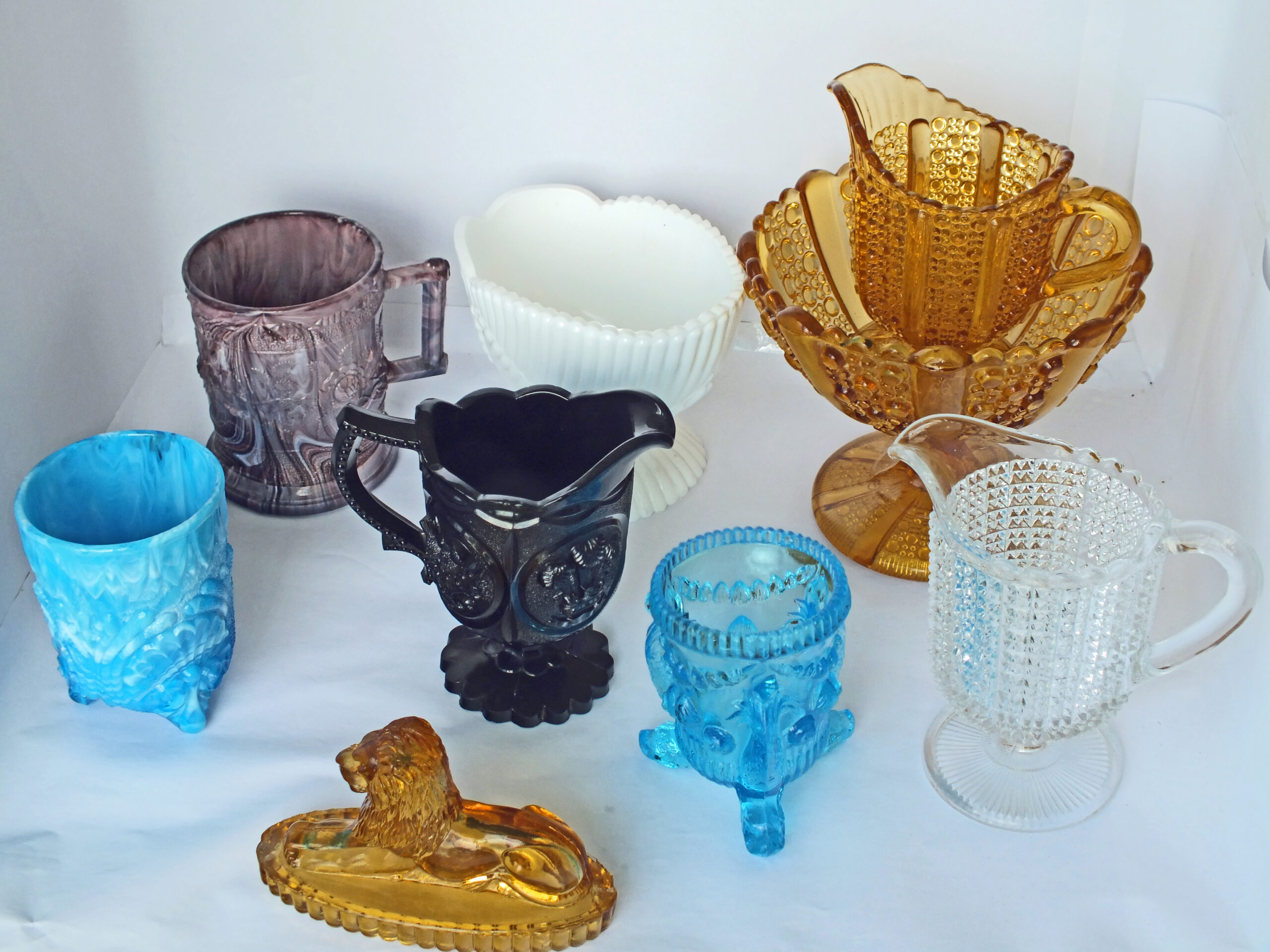 small collection of pressed glass pieces